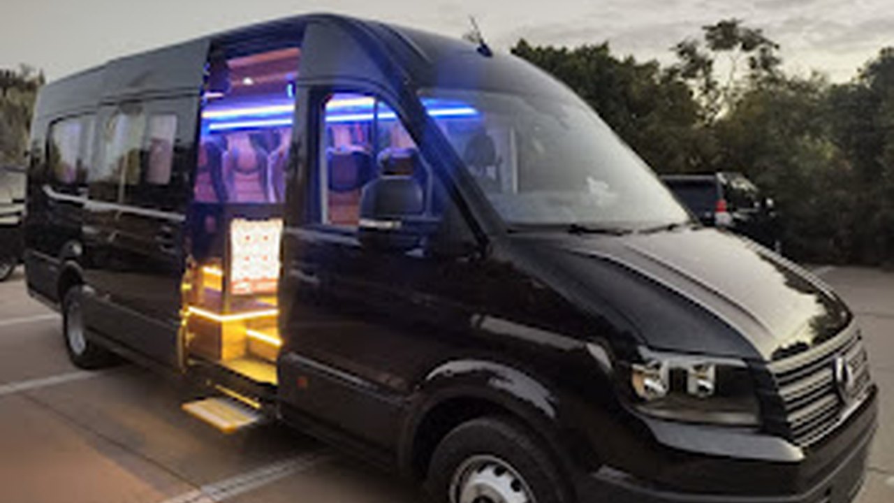 Black VW Crafter VIP minibus with LED mood lighting for luxury group tours in Morocco